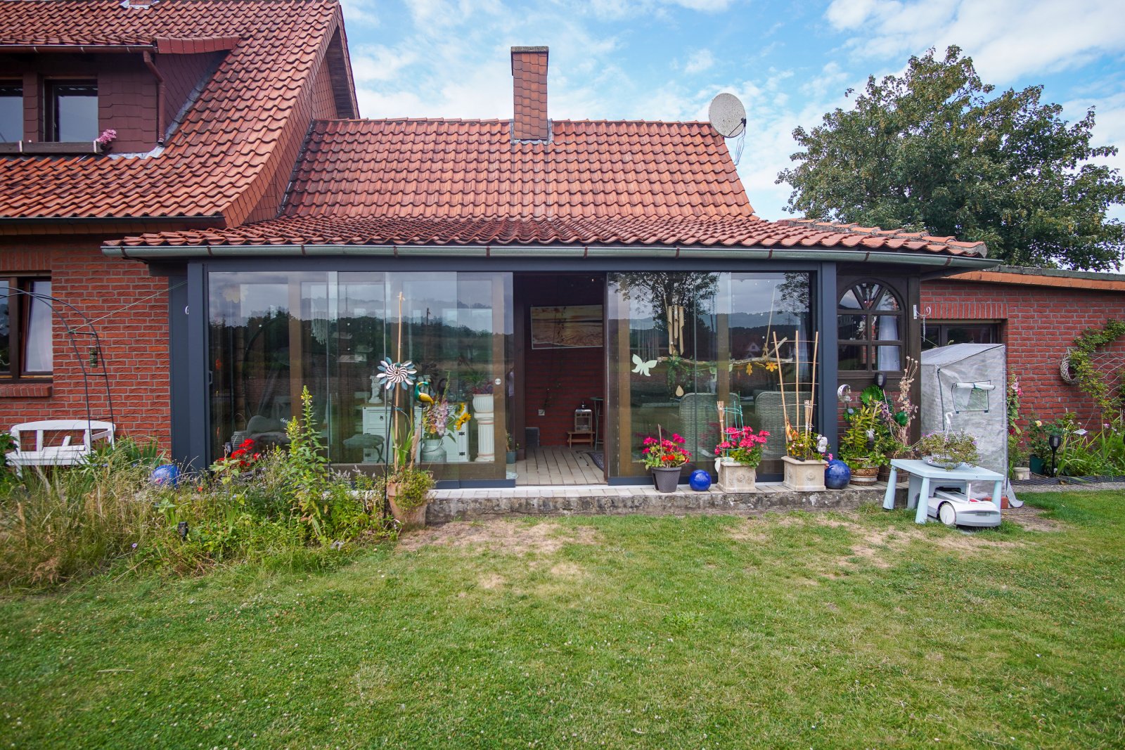 Wohngenuss mit Charme - gepflegtes Ein- bis Zweifamilienhaus mit Wintergarten